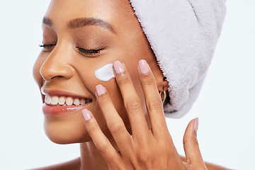 Image showing Black woman, beauty and skincare cream for face in studio for dermatology and cosmetics. Aesthetic model person hand on facial product for healthy and natural glow skin isolated on a white background