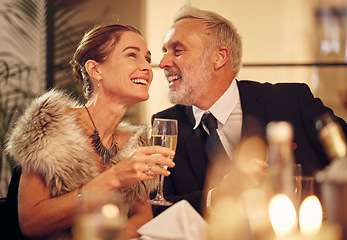 Image showing Happy, senior and couple celebration dinner with wine glass and smile of woman with funny man. New years party with mature guests smiling together for joke in elegant, classy and formal style.