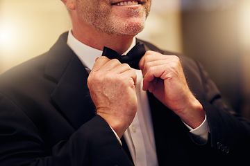 Image showing Hands, wedding and bow tie with a groom getting ready for his marriage ceremony of tradition or celebration. Fashion, event and celebrating with a man wearing a suit as a gentleman to be married