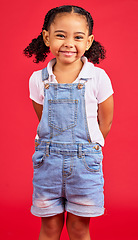 Image showing Child, little and portrait of girl in studio, happy and smile on red background with mockup. Face, cheerful and trendy toddler standing against space, excited and positive, smiling and pose isolated