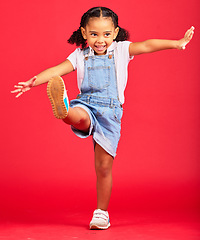 Image showing Happy, youth and girl on red background kick legs for happy childhood, positive mindset and smile. Fashion mockup, summer style and cute face of child in studio with freedom, carefree and happiness