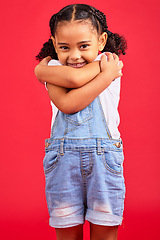 Image showing Portrait, hug and girl in studio, happy and smile against red background with mockup. Face, love and caring toddler standing against space, embrace and positive, smiling and self love while isolated