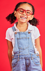 Image showing Happy child, portrait or fashion glasses on red background in children style, eyes care or wellness health. Smile, kid or little girl and optometry frames for cool vision support or medical insurance