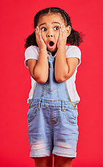 Image showing Little girl, shocked or hands on face by isolated red background in kids gossip, bad news or scary children story. Surprised, anxiety or scared youth with horror facial expression, wow or emoji look