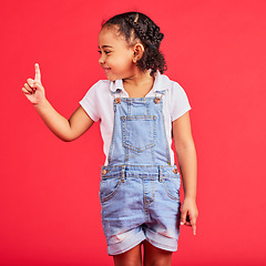 Image showing Mockup, black girl and finger for space, product placement and kid on studio background. African American female child, young person and brand development for advertising, happiness and cheerful