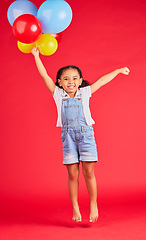 Image showing Little girl, portrait or jumping with balloons on isolated red background for birthday party, celebration or fun event. Smile, happy or energy child with air, flying or inflatable accessory in studio