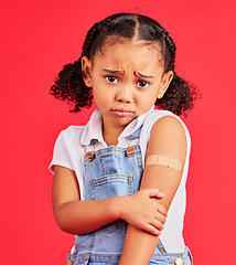 Image showing Child portrait, sad and arm plaster in covid vaccine, injection and fall injury on isolated red background. Upset, unhappy and hurt girl and bandage in medical help, healthcare wellness and first aid