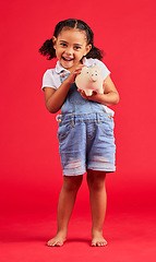 Image showing Excited child, portrait and piggy bank in money planning, savings or future investment on isolated red background. Smile, happy and kid with cash box for finance growth, budget learning in studio