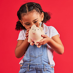 Image showing Little girl, excited and piggy bank savings in money planning, finance management or future investment on isolated red background. Smile, happy child and cash box in finance growth or budget learning