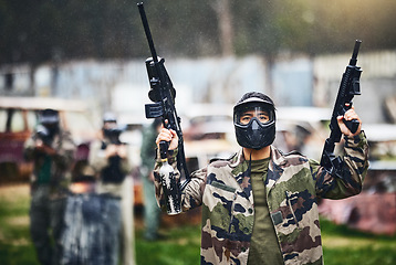 Image showing Paintball, gun or man ready for a shooting game with fast action on a fun battlefield on holiday. Mission, man or player with military weapons gear for survival in an outdoor competition playground