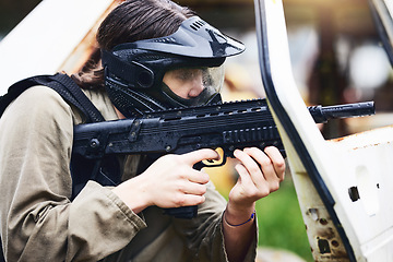 Image showing Paintball, gun or woman in a shooting game playing with fast action on fun battlefield on holiday. Military mission, target aim or player with weapons gear for war survival in an outdoor competition