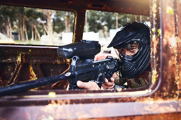 Image showing Paintball, aim or man with a gun in shooting game with action on a fun battlefield on holiday. War mission, focused or calm player with military weapons gear for survival in an outdoor competition