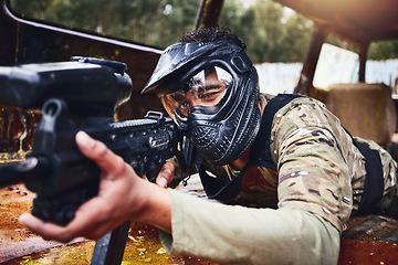 Image showing Paintball, gun or soldier in a shooting game with fast action on a fun battlefield on holiday. Military mission, target or focused man with war weapons gear for survival in an outdoor competition