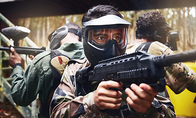 Image showing Men, teamwork or paintball gun in games arena, competition or sports challenge in military uniform. Soldiers, army or people and shooting paint equipment in warfare training or battlefield protection