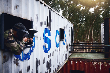 Image showing Paintball, gun or player in a shooting game with war action on a fun battlefield on holiday vacation. Military mission, fitness or man aiming with weapons gear for survival in an outdoor competition