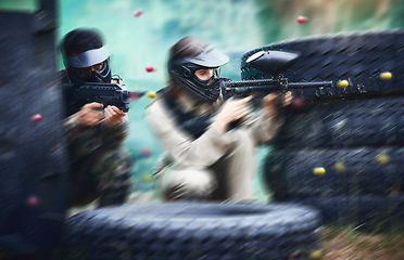 Image showing Paintball, gun or people in a shooting action game with fast action on a fun battlefield on holiday. Men on mission, war or players with military weapons gear for survival in an outdoor competition