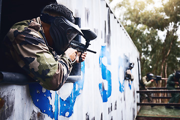 Image showing Aim, gun or people in a paintball shooting game with fast action on a fun battlefield on holiday. Man on mission, playing or player with military weapons gear for survival in an outdoor competition
