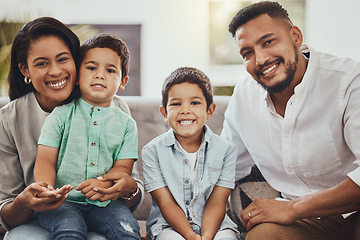 Image showing Father, mother and children with smile for family portrait, holiday break or weekend relaxing on living room sofa at home. Happy dad, mom and kids smiling for fun bonding time or relationship indoors