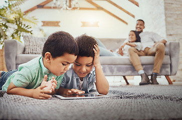 Image showing Tablet, children on carpet and family relax on sofa for home internet, elearning development app or online games. Kids on ground or floor and digital technology for youth website and parents on couch