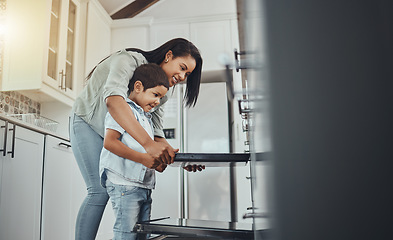 Image showing Baking, fun and child helping mother with food, cooking and learning by the oven in the kitchen. Breakfast, happy and mom and boy kid making lunch, dinner or a snack together in their family home