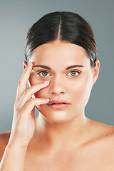 Image showing Woman, beauty and portrait in studio for skincare, wellness and facial cosmetics. Young female model touching face, aesthetic makeup and dermatology from healthy shine, natural glow and salon results