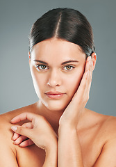 Image showing Skincare, portrait and woman touching face in studio for wellness, luxury facial and cosmetics. Young female model, aesthetic beauty and dermatology from healthy shine, natural glow and salon results