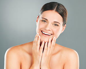 Image showing Skincare, wellness and portrait of a woman in a studio with a cosmetic, beauty and natural face routine. Cosmetics, health and female model with a healthy facial treatment isolated by gray background