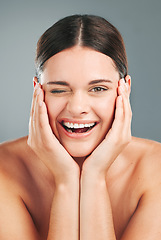 Image showing Beauty, wellness and portrait of woman wink on gray background for cosmetics, facial treatment and spa. Dermatology, skincare and face of happy girl for glow, healthy skin and natural smile in studio