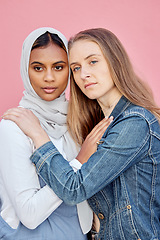 Image showing LGBTQ, love and lesbian couple with embrace of sexuality isolated on a pink background. Freedom, hug and diversity in a relationship with women hugging for affection, romance and a date on a backdrop