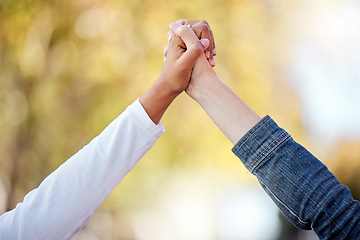 Image showing Support, love and friends holding hands in the city for community, freedom and trust in Singapore. Care, collaboration and people with solidarity, romantic gesture and compassion together in town