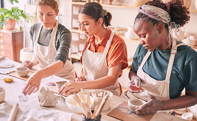 Image showing Pottery class, ceramic workshop or group design sculpture mold, clay manufacturing or art product. Diversity people, retail sales store or startup small business owner, artist or studio women molding