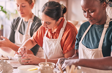 Image showing Pottery class, creative workshop or people design sculpture mold, manufacturing or art product. Diversity women, ceramic retail store or startup small business owner, artist or studio group molding