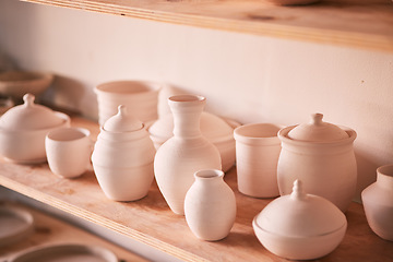 Image showing Pottery background, creativity and shelf in studio, creative store or manufacturing startup. Clay design, collection and display in workshop, small business and retail craft shop of stock production