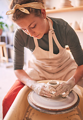 Image showing Woman, sculpture artist and mud wheel for clay design, creative manufacturing and expert focus in studio workshop. Female, pottery process and small business designer working with ceramic craft