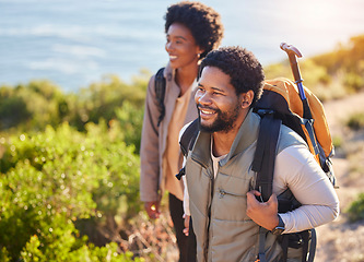 Image showing Mountain, happy or couple of friends hiking in nature for exercise, workout or training on summer holiday. Travel, black woman and African partner trekking or walking to hill on outdoor adventure