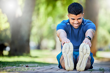 Image showing Stretching, exercise and fitness man outdoor at park for cardio workout, training and warm up. Happy sports person or athlete in nature for a run and energy for muscle health and wellness goals