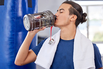 Image showing Fitness, man and drinking water in gym for health, rest and energy for boxing, workout and towel. Thirsty sports person, bodybuilder and athlete hydration, bottle and exercise nutrition for wellness