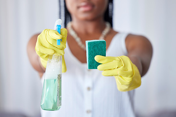 Image showing Hands, spray bottle and sponge with a black woman cleaner in a home for housework, hygiene or cleaning. Gloves, spraying and equipment with a female maid in a house for domestic housekeeping