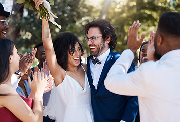 Image showing Happy bride and groom celebrate wedding with excited and cheerful applause in crowd of guests. Interracial love and happiness of couple at marriage event together with clapping and smile.