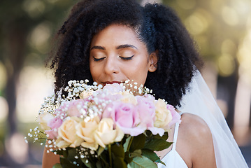 Image showing Eyes closed, bride and black woman with flowers at wedding outdoors. Face, marriage and beauty of female smelling floral bouquet of roses to celebrate at party, ceremony event or love celebration