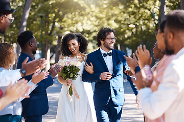 Image showing Happy celebration and clapping for couple at wedding with excited, joyful and cheerful crowd of guests. Interracial love and partnership of people at marriage event with applause and smile