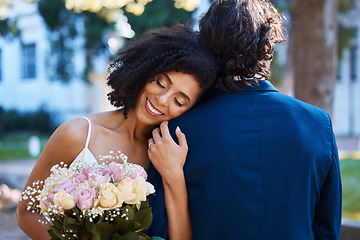 Image showing Wedding, happy bride and couple outdoor for marriage celebration event together with commitment. Married interracial man and woman at ceremony with trust, partnership and a hug with flower bouquet