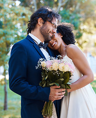 Image showing Wedding hug, couple and bride marriage bouquet outdoor in a garden happy about love with flowers. Roses, happiness hug and woman with man at a commitment and care celebration with flower and smile