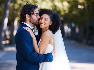 Image showing Interracial wedding and couple kiss portrait at romantic outdoor marriage event celebration together. Partnership, commitment and trust embrace of happy bride and groom with excited smile.