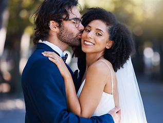 Image showing Wedding bride and groom kiss portrait at romantic outdoor marriage event celebration together. Partnership, commitment and trust embrace of interracial people with excited and happy smile with bokeh