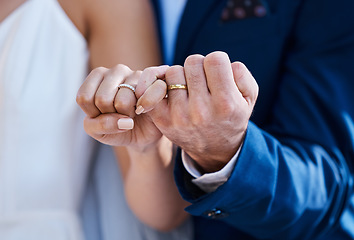 Image showing Hands, pinky promise and wedding ring of bride with groom for outdoor celebration of partnership, care and love. Marriage commitment and trust of interracial couple at event with togetherness zoom