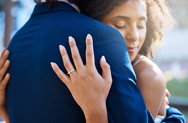 Image showing Love romance, wedding ring and couple hug outdoors, bonding or caring. Marriage band, commitment hand and diversity, affection and care of woman and man or bride and groom hugging, embrace and cuddle