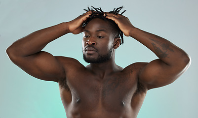 Image showing Black man, hair and muscle with skin, face and beauty, skincare and fitness with body isolated on studio background. Health, wellness and grooming, strong bodybuilder and power with hygiene and clean