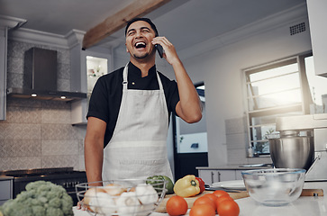 Image showing Man, phone call and laughing or cooking in kitchen for healthy nutrition, food diet and organic vegetables salad. Young male, chef happiness and smile for smartphone call or cook dinner in home