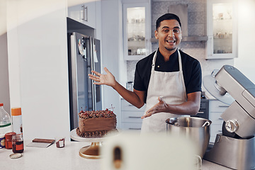 Image showing Man, chef and talking in kitchen on vlog, live streaming and recording a cake dessert tutorial on social media. Happy baker, digital content creator or food influencer filming a virtual cooking class